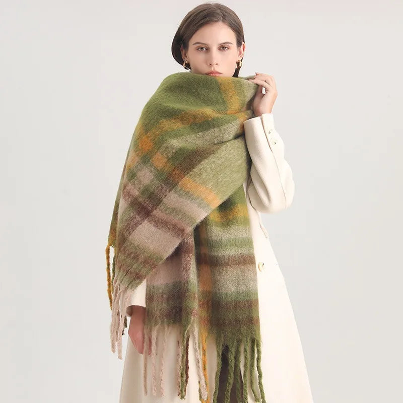 Woman wearing a green plaid shawl on a white background