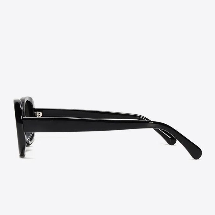 Black sunglasses with a brand logo on a white background