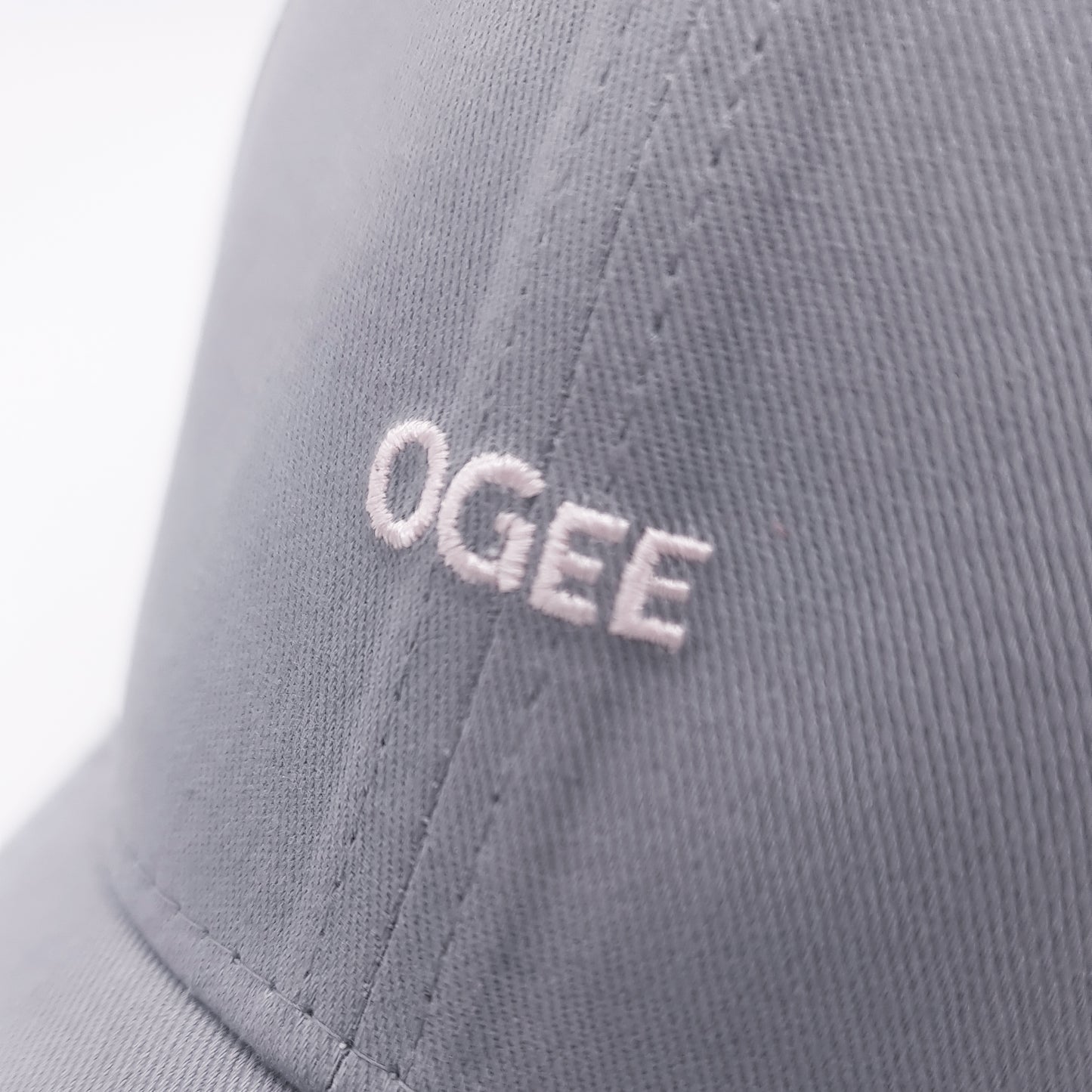 Gray cap with 'OGEE' logo on a white background