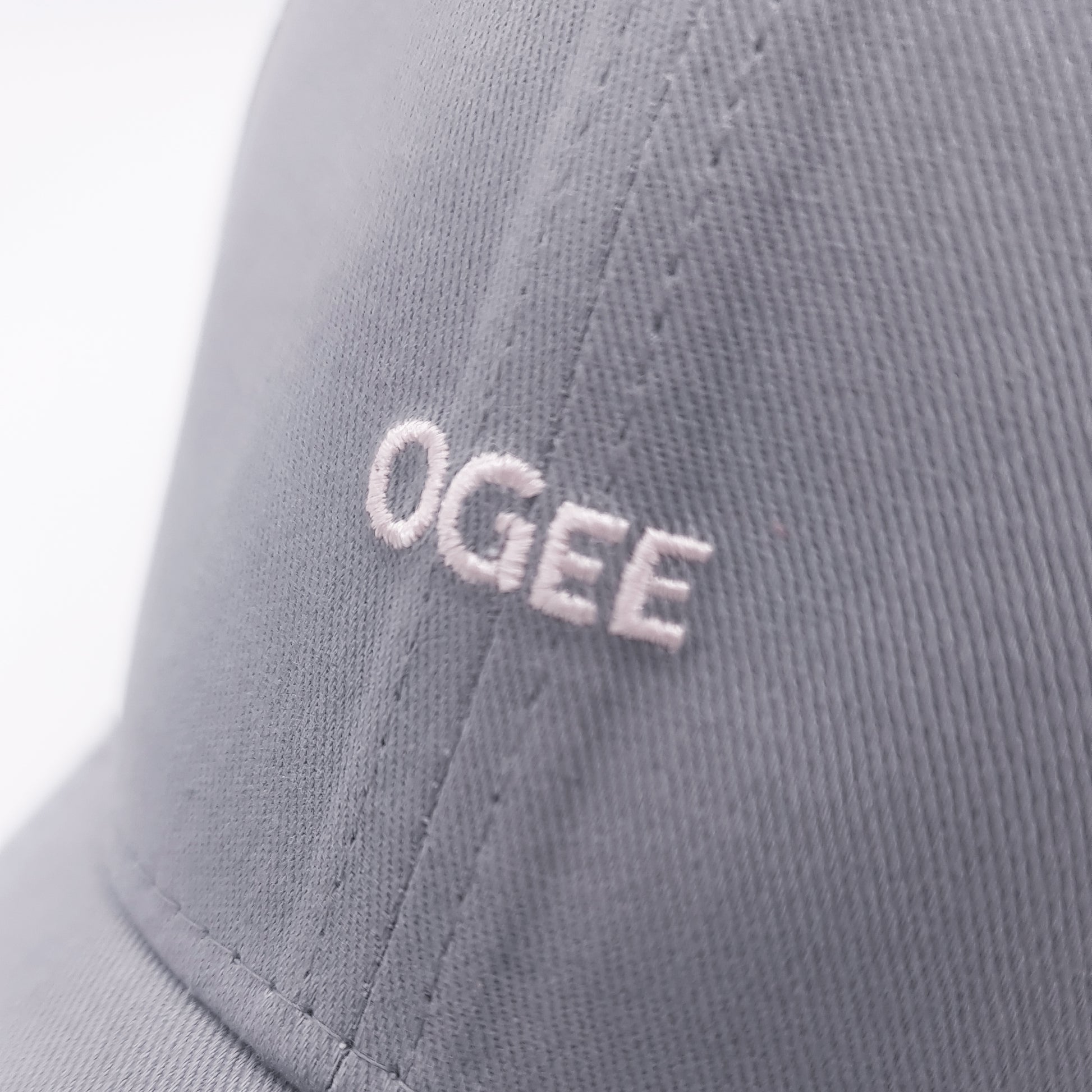 Gray cap with 'OGEE' logo on a white background