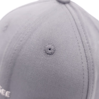 Close-up of a gray cap with a small defect on the fabric.