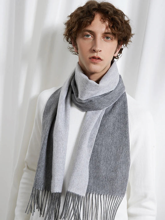 Person wearing a gray scarf with white background