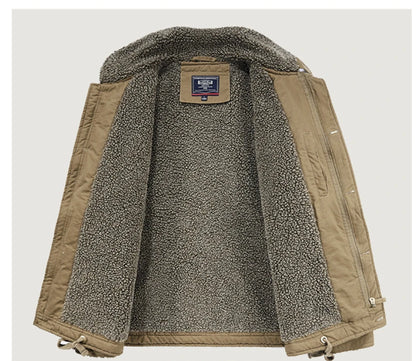 A tan quilted jacket with a thick gray and white sherpa fleece lining, shown open against a light gray background.