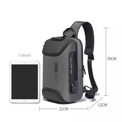 Gray sling bag with measurements and an iPad for scale on a white background