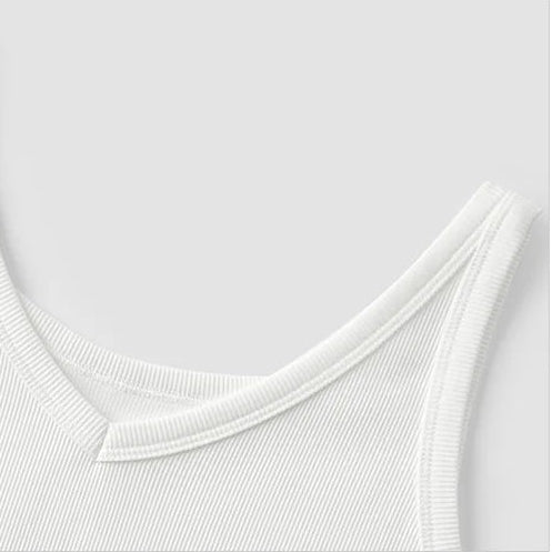 Close-up of a white tank top with a V-neck design on a light gray background.