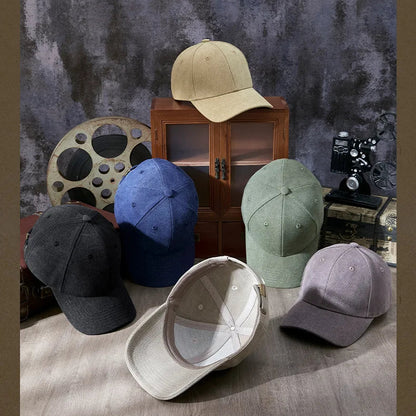 Collection of baseball caps in various colors on a textured surface with a vintage background.