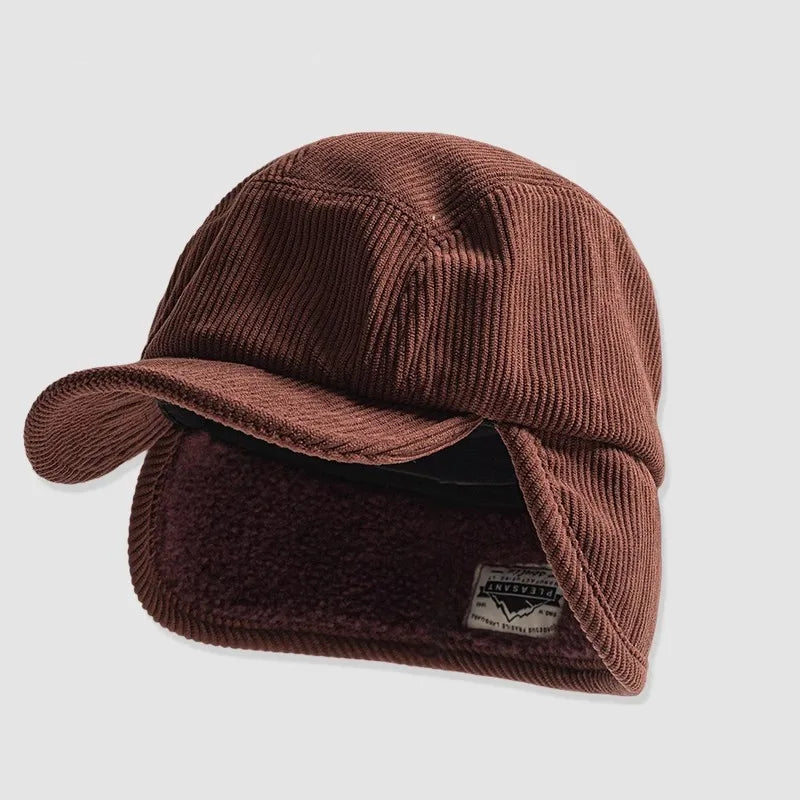 Brown knit cap with ear flaps on a light gray background, featuring the Banlei brand.