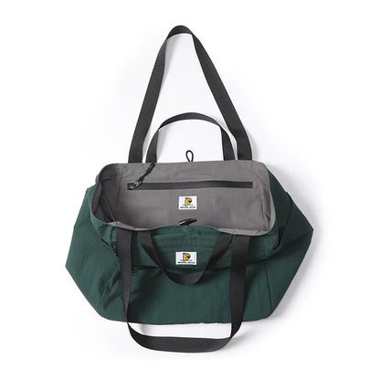 Green travel bag with a gray interior on a white background, featuring the P.Travel brand.