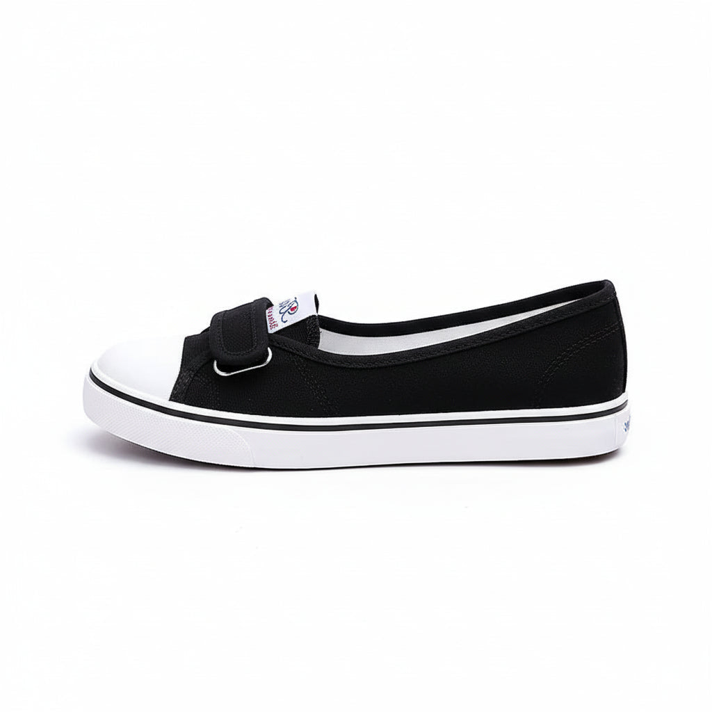 Black and white shoes with velcro straps on a white background.