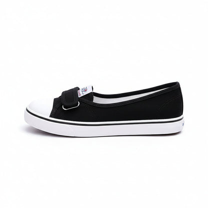 Black and white shoes with velcro straps on a white background.
