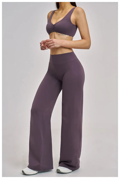 Person wearing a purple athletic outfit on a gray background