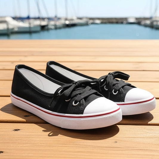 Black and white sneakers on wood deck merina.