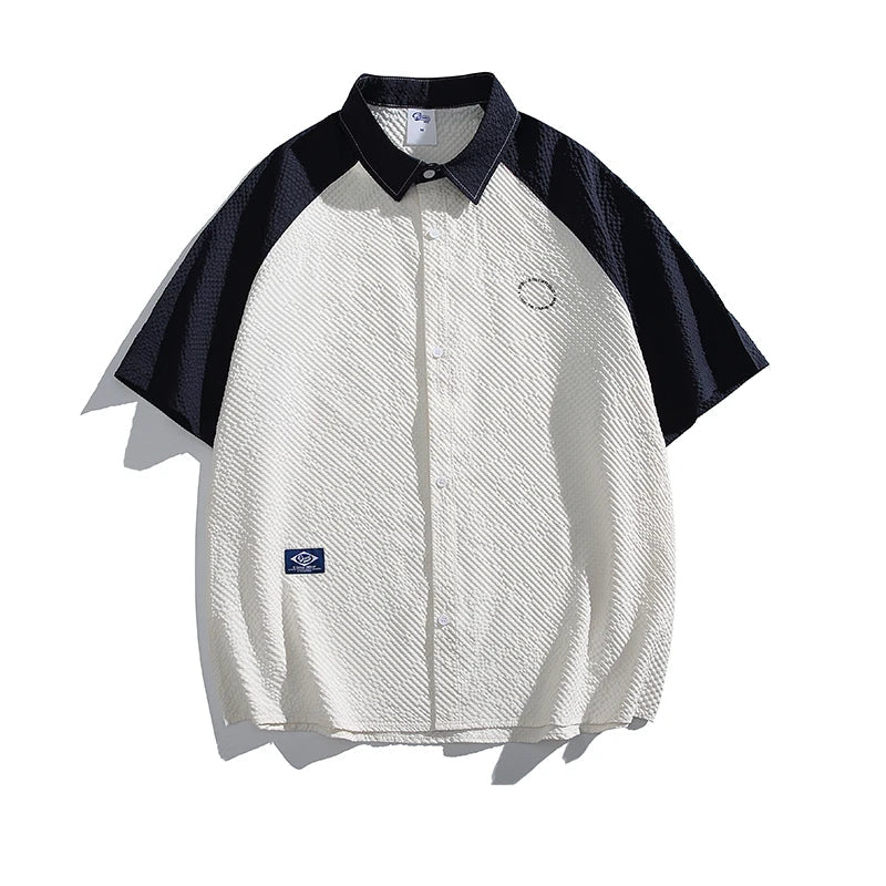 White and black short-sleeve shirt with a brand logo on a white background