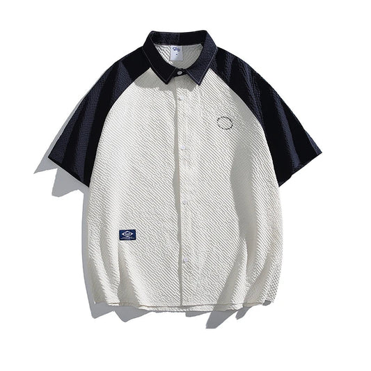 White and black short-sleeve shirt with a brand logo on a white background