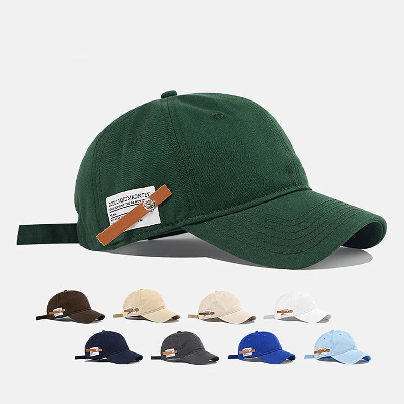 Green baseball cap with a brown strap and visible brand logo on a white background
