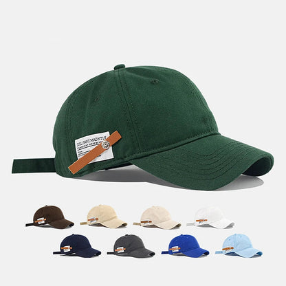Green baseball cap with a brown strap and visible brand logo on a white background