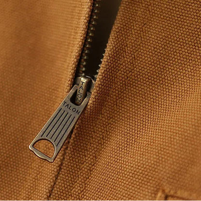 Close-up of a brown fabric with a zipper featuring the brand 'Talon'.