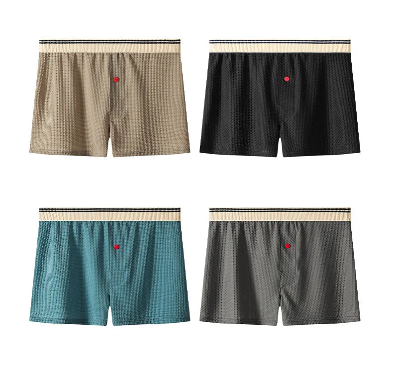 Four pairs of men's boxer briefs in different colors on a white background.