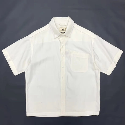 White short-sleeve shirt on a dark background