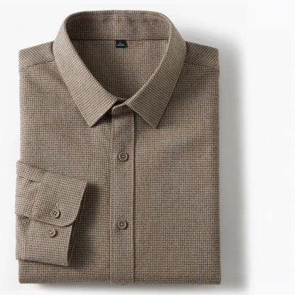 A folded long-sleeve button-down dress shirt in a fine micro-check pattern of brown and beige, displayed on a clean white background.