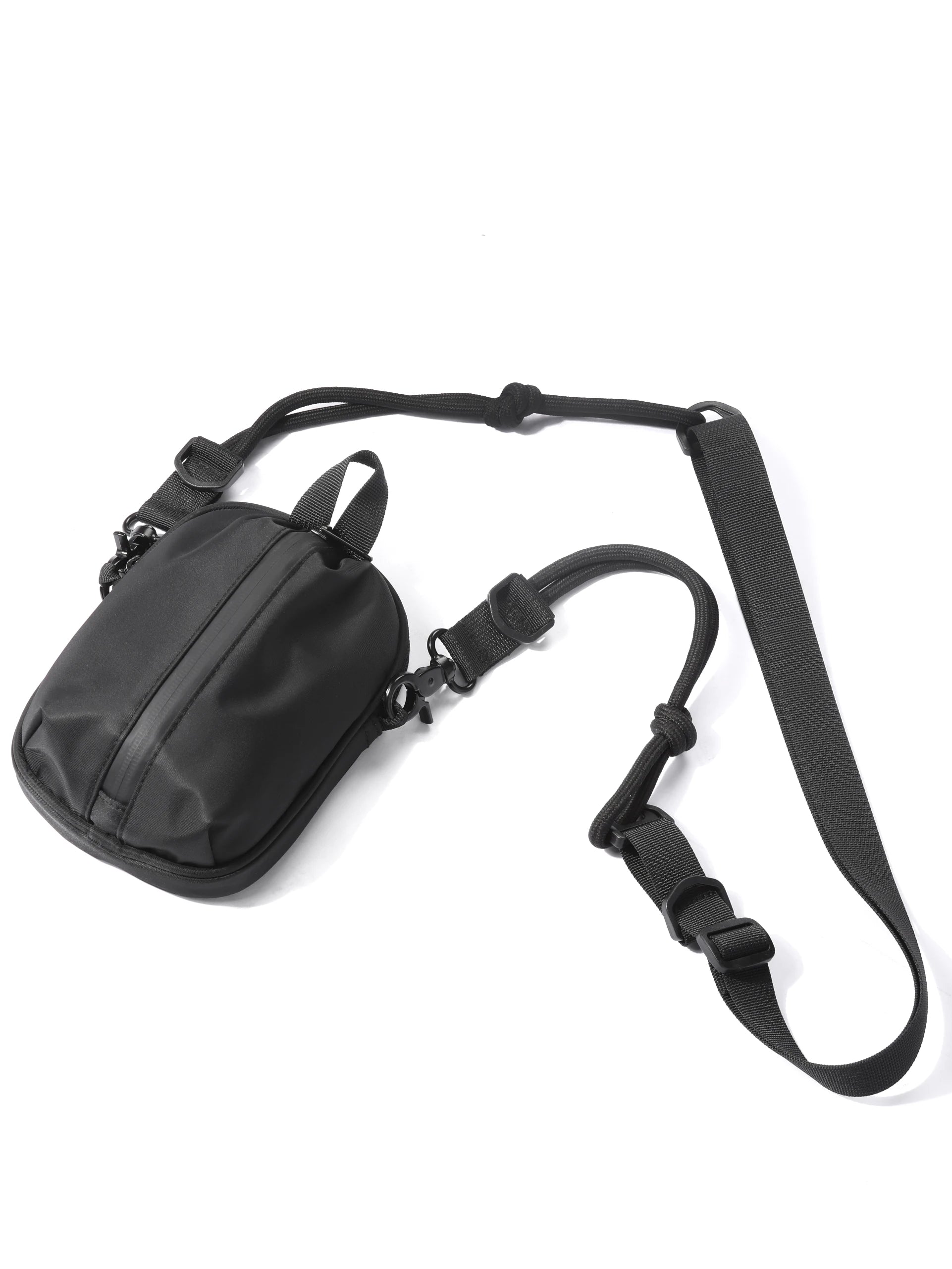 Black shoulder bag with a strap on a white background