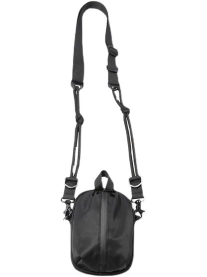 Black shoulder bag with a strap on a white background