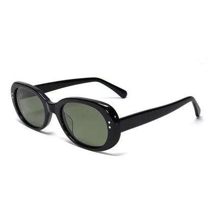 Black sunglasses with green lenses on a white background, branded 'Starlight'.