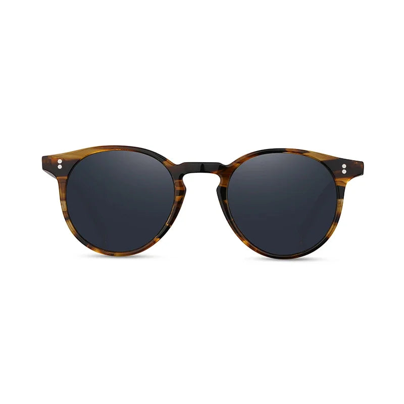 Sunglasses with tortoiseshell frame and dark lenses on a white background