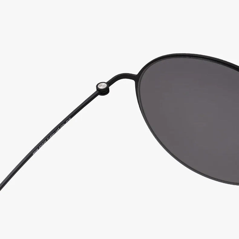 Black sunglasses with a reinforced hinge design on a white background