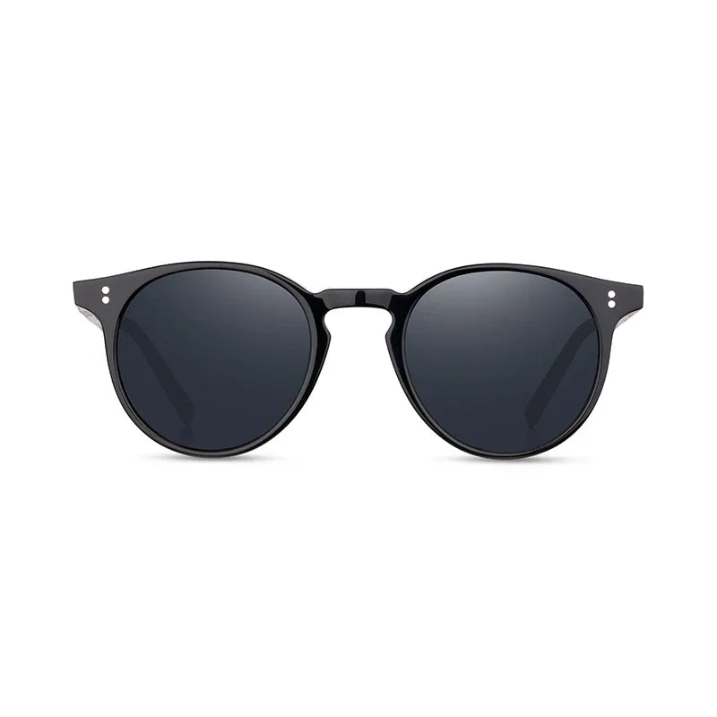 Black sunglasses with dark lenses on a white background