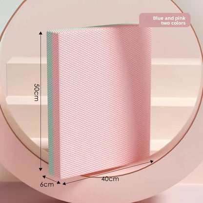 Pink and blue textured book with measurements on a light pink background