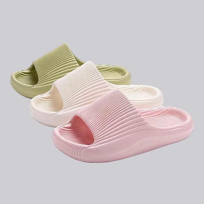 Three slippers in green, white, and pink on a gray background with 'IPOMOEA' branding.
