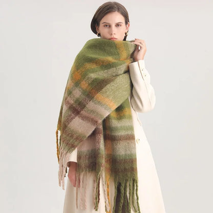 Woman wearing a green plaid shawl on a white background