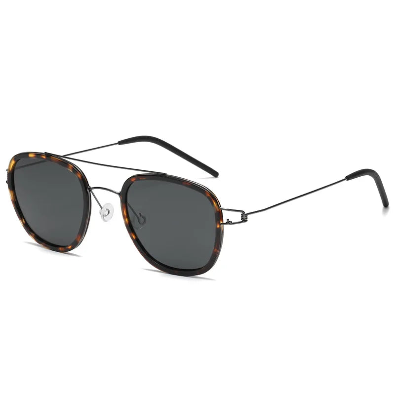 Sunglasses with tortoiseshell frame and dark lenses on a white background