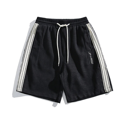Black shorts with white stripes on a white background