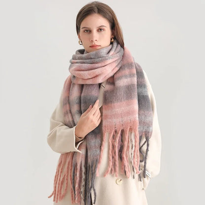 Woman wearing a pink and gray plaid scarf on a white background
