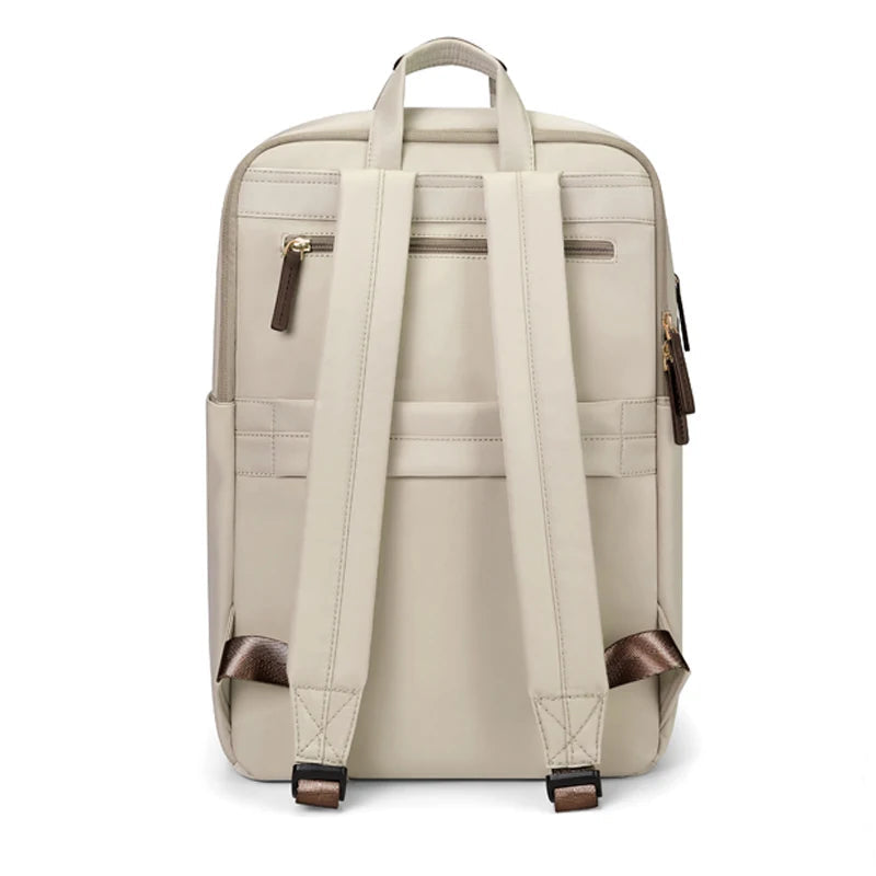 A light beige backpack shown from the back, featuring dual padded shoulder straps, top carry handles, zippered pockets, and brown leather accents on the zipper pulls and bottom straps. The brand name 'GOLF' is printed in dark blue in the top-left corner.