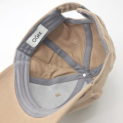 Beige cap with gray interior and OGEE label on a white background